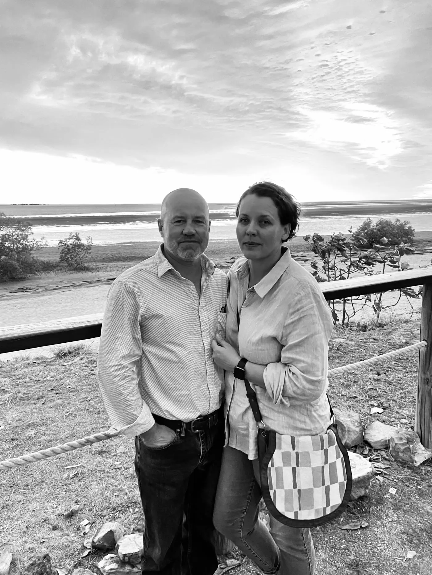 Mark and Fiona Peart, the owners, standing by the beach at low tide
